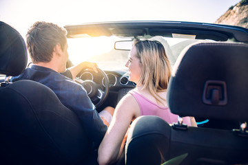 Couple on convertible car