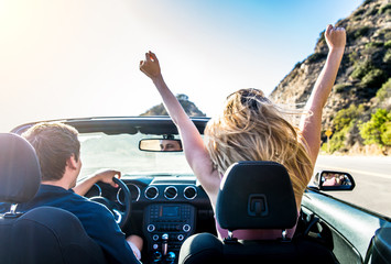 Couple on convertible car