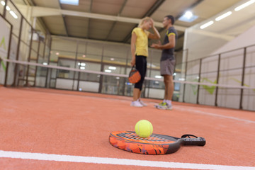 playing padel indoors