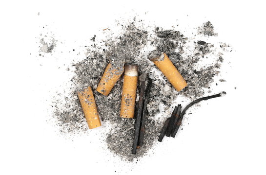 Cigarette stubs, butts, burned matches and ash isolated on white background, top view