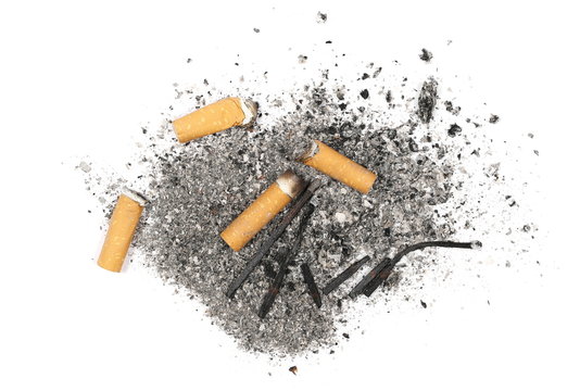 Cigarette stubs, butts, burned matches and ash isolated on white background, top view