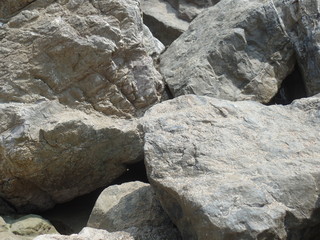 Large grey rocks on the Italian coast