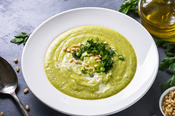 Cream soup with zucchini, herbs and cream.