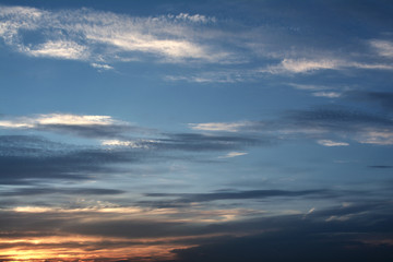 The rays of sunset through dark clouds are majestic, dramatic.