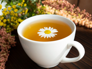 bouquet of flowers, a Cup of tea on a dark background