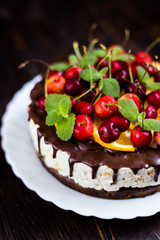 Cake with chocolate icing and fruit