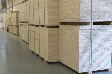 Warehouse of fiberboard and chipboard. Construction Materials. Wooden warehouse