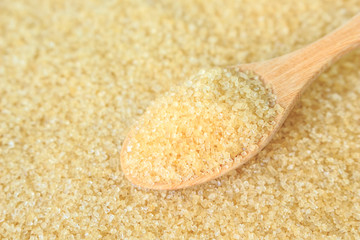 sugar cane brown on spoon and background