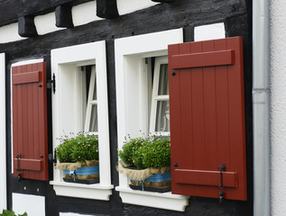 Fototapeta na wymiar old small German town on the river bank narrow streets, pavement flowers on the windows