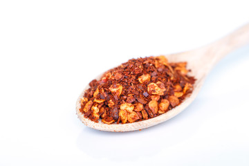 cayenne pepper spoon on white background