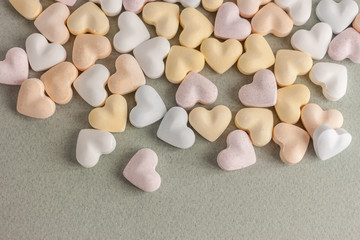 colorful candy hearts on craft background