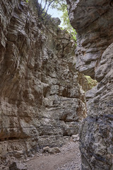 Greece. Crete. The Imbros Gorge. Steep slopes of multi-layered rocks