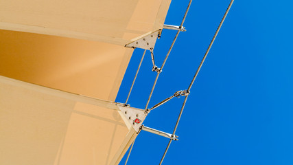 Sunshades And Metal Poles Under The Blue Sky