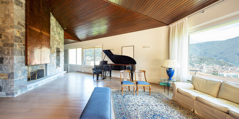 Modern living room with wooden ceiling in the villa © alexandre zveiger