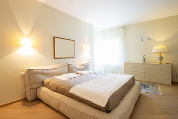 Elegant bedroom in modern villa