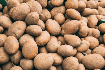 Organic Brown Potatoes On Agricultural Market.