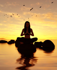 3d illustration of silhouette woman doing meditation yoga on the stone at the sea