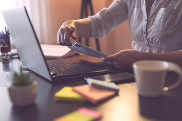 Businesswoman joining pages of contract