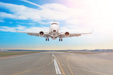 Fototapeta na wymiar Passenger aircraft with on the asphalt landing on a runway airport, motion blur.