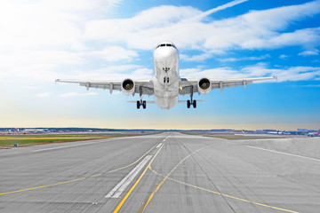 Fototapeta na wymiar Passenger airplane the asphalt landing on a runway airport.