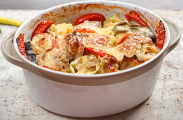 Traditional tasty rustic stew of chicken and vegetables, decorated with tomatoes