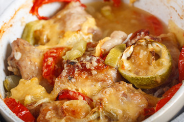 Traditional tasty rustic stew of chicken and vegetables, decorated with tomatoes