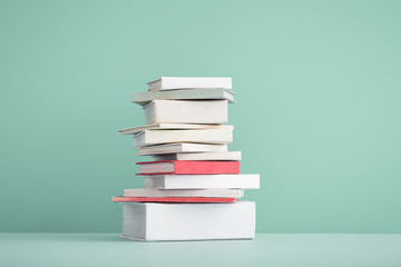 Stack of mini old books.	