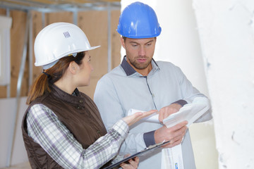 construction manager and engineer working on building site