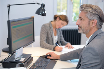 mature businessman working on computer in office
