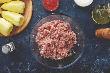 Meat, rice and onion stuffing in the glass bowl for filling of sweet pepper.