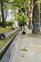 water pipe in a construction site in the middle of the street.