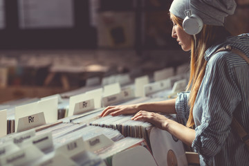 Young attractive woman in music store