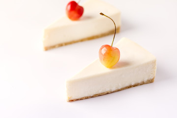 Piece of Tasty Vanilla Cheesecake on Cake Paddle on White Background Tasty Cheesecake Copy Space