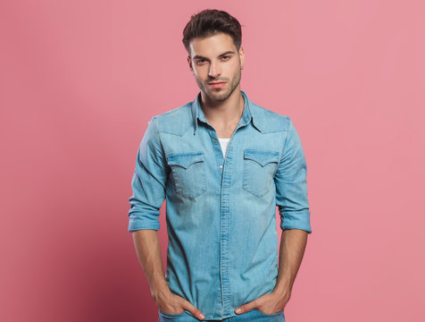 portrait of relaxed young man wearing a denim shirt