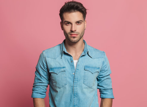 portrait of smiling handsome man wearing a denim shirt