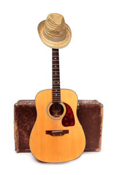 Old suitcase and guitar in country style on a white background