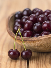 cherries on a wooden table. 