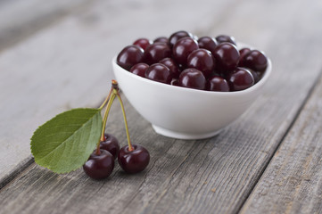 cherries on a wooden table. 