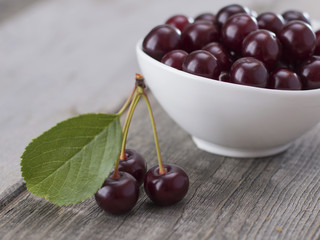 cherries on a wooden table. 
