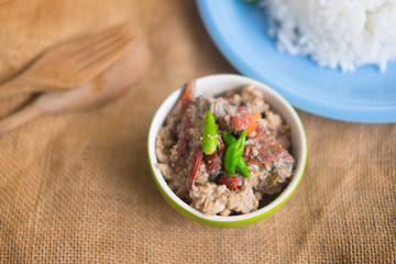Crab dip with coconut milk in green bowl