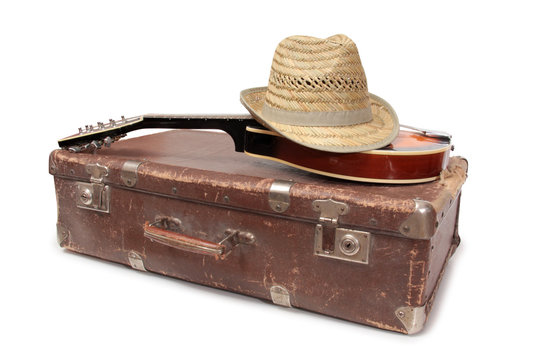 Old suitcase and mandolin in country style on a white background