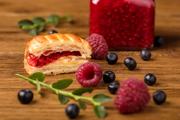 Fresh tasty pastries with raspberry jam.