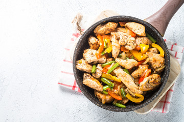 Chicken fried with vegetables.