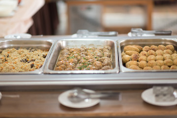 Buffet trays and white plates