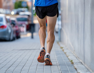 closeup runners legs with urban city background