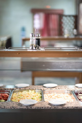 Buffet trays and white plates