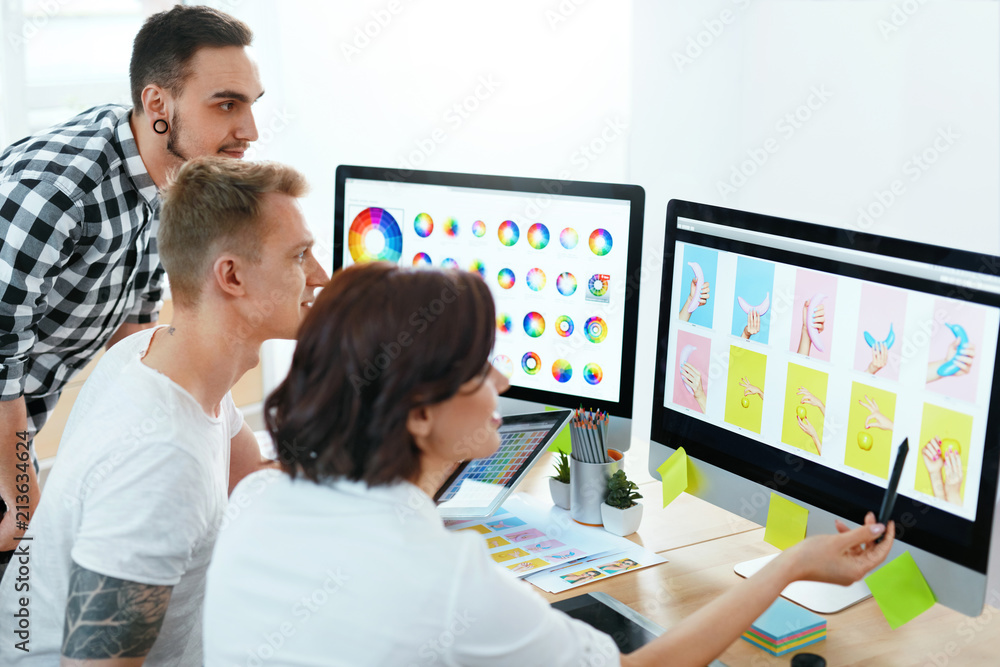 Poster Web Design. Team Of Designers Working On Computer In Office