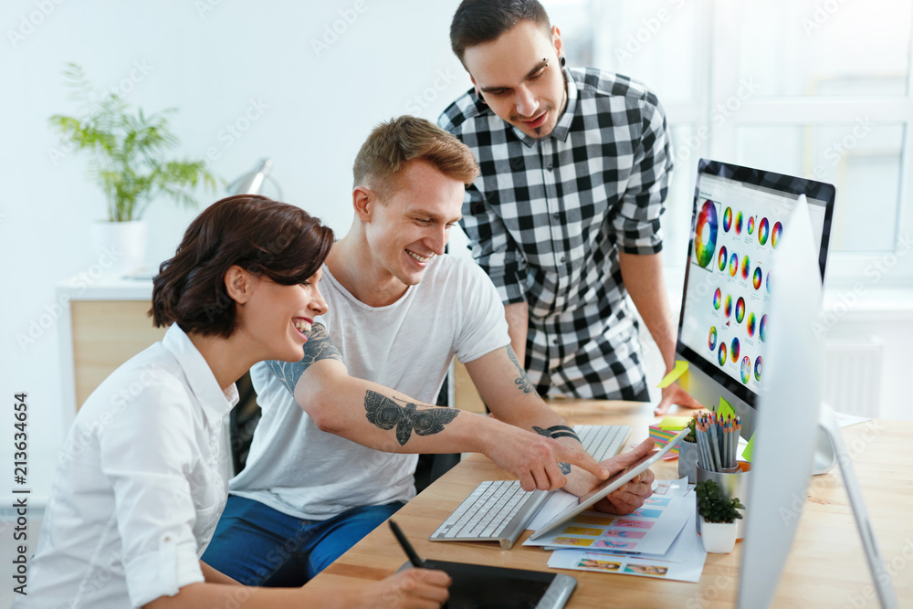 Poster Web Design. Team Of Designers Working On Computer In Office