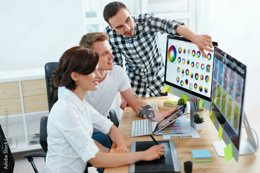 Poster Web Design. Team Of Designers Working On Computer In Office