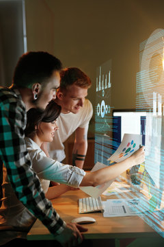 Programmers Working On Software In Office